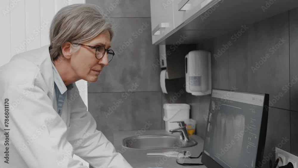 Dentist Professor Analyzing Teeth X-ray on Screen Dentist Professor Analyzing Teeth X-ray on Screen
