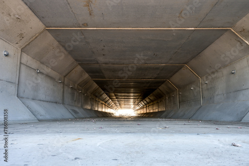 Focus stacked image inside a concrete box culvert under a road for stormwater drainage. 