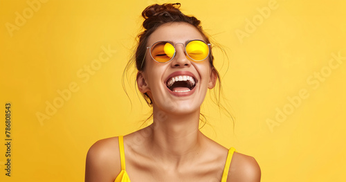 Woman with obscured face in yellow background
