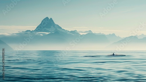 Man taking a swim in the ocean with a scenic mountain vista. Refreshing aquatic excursion amidst stunning coastal landscapes