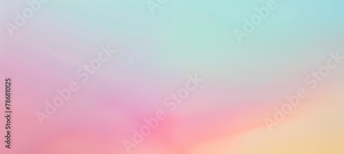 Blurred image of pink, blue, and yellow clouds in the afterglow photo