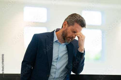 Man with sinus headache, tension or cluster headache, close up portrait. Head pain concept. Cephalalgia and migraine. Migraine symptoms. Chronic headaches. Headache triggers.