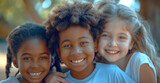 Radiant Joy of Childhood, Three Happy Children Embracing Outdoors, Multiracial Friendship