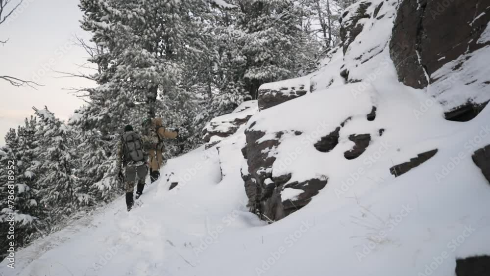 Archery Bow Elk Hunting in the snow in Montana in October on top of the mountains Archery Bow Elk Hunting in the snow in Montana in October on top of the mountains