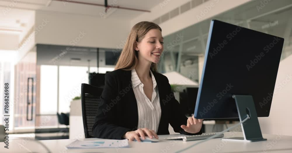 Smiling businesswoman, financial analytics or marketer make research working in modern corporate office seated at desk use personal computer. Prepare report, do on-line presentation or sales analysis Smiling businesswoman, financial analytics or marketer make research working in modern corporate office seated at desk use personal computer. Prepare report, do on-line presentation or sales analysis