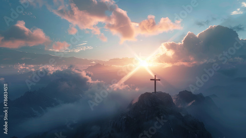 A cross is on top of a mountain, with a bright sun shining on it
