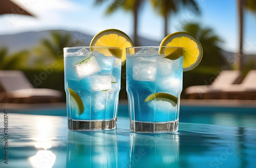 Two blue lagoon cocktails by the pool. High quality photo
