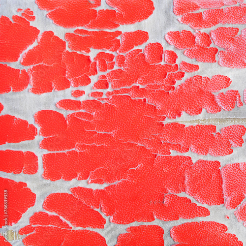 Close up of lack old red leather seat .Abstract background of torn old leather sofa for design usage purpose. © prapann