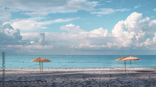 beach with umbrellas and chairs, Beach in Miami, FL. Open umbrellas on the sand beach at the ocean. Empty beach. Sea shore. Early morning. Clouds background.