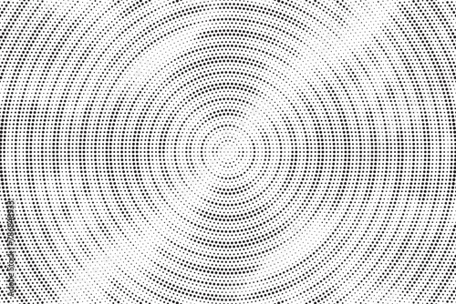 Abstract radial halftone texture. Monochrome background of black dots on white. Dotted background as design element. 