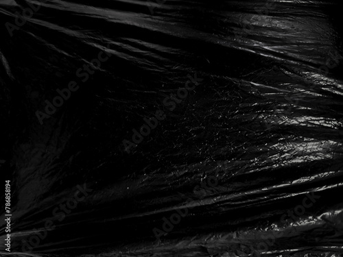 Black transparent plastic wrap texture overlay background. Realistic plastic for poster design and photo overlay effect. Wrinkled plastic surface pattern for graphic design sources and element.