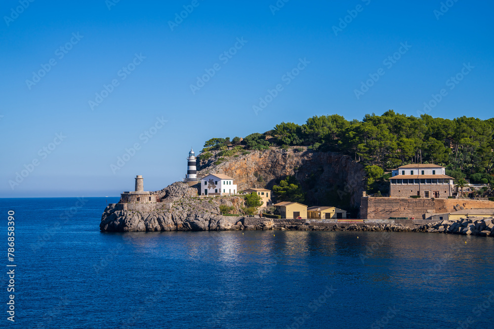View of the lighthouse at the entrance to Soller Bay, Port de Soller, Mallorca, Spain. Famous, tourist destination