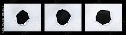 Closeup of a dark holes on white paper set
