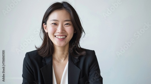 Inspiring Asian startup founder radiant smile photo