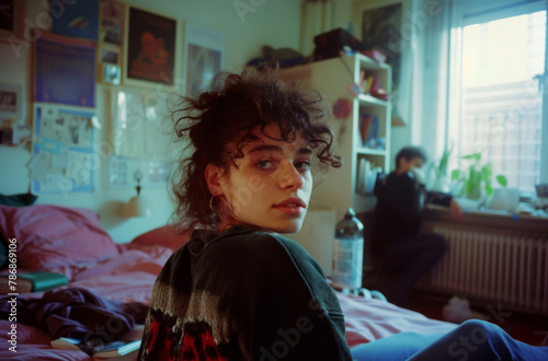 Young Woman with Curly Hair Contemplating in a Cozy Room