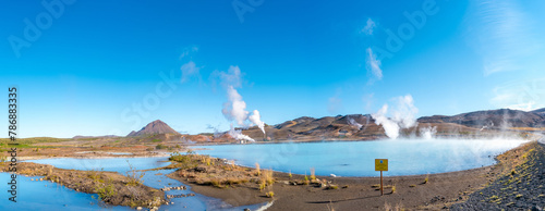 Panoramic over geothermal active zones with power plants in Iceland, near Myvatn lake, summer and blue sky