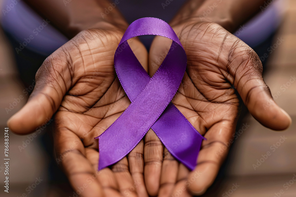 Close up of elderly black man's hands holding large purple Alzheimer disease awareness ribbon - obrazy, fototapety, plakaty 