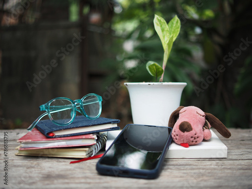 work space in garden green garden background relax and tecnology mobile