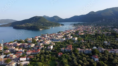 Aerial drone video of famous seaside village and port of Nydri famous for trips to Ionian islands and nearby beaches, Lefkada, Greece photo