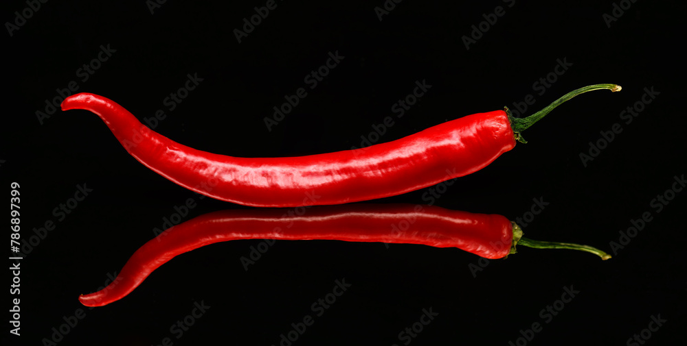 red chili pepper on a black background red chili pepper on a black background