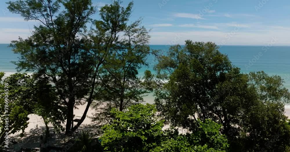 Tropical beach and blue sea through the trees view from above. Sabah, Borneo, Malaysia. Tropical beach and blue sea through the trees view from above. Sabah, Borneo, Malaysia.