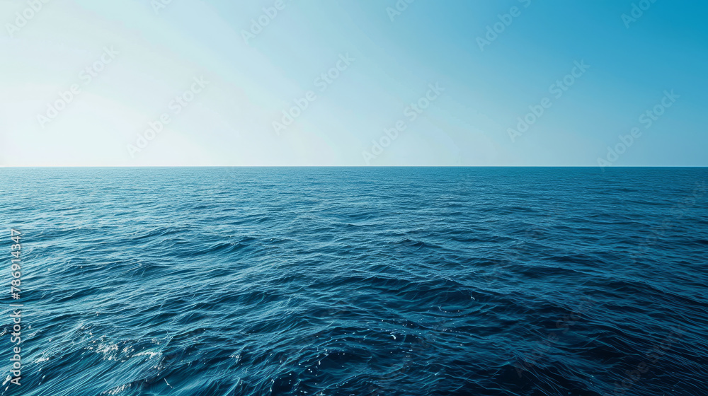 Fototapeta premium A boundless view of the ocean's horizon under the soft light of dusk, illustrating the vastness of the sea..