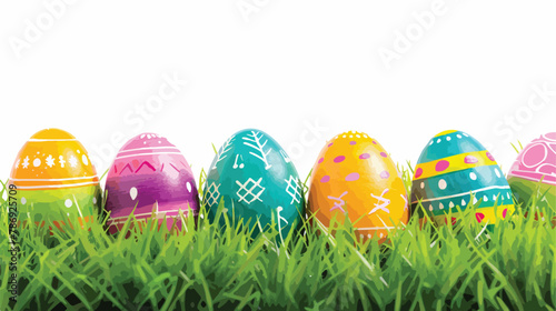 Colorful Easter eggs rest on vibrant green grass agai