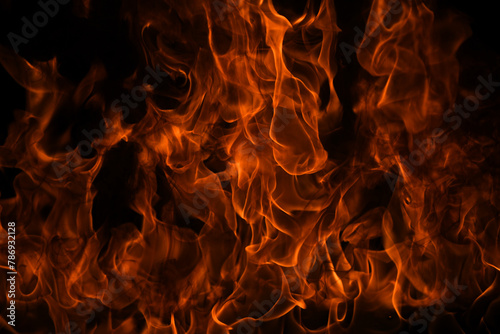 Texture of fire on a black background. Abstract fire flame background, large burning fire. photo