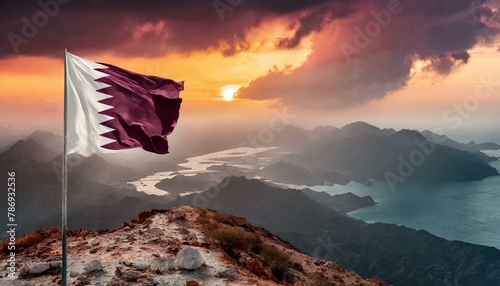 The Flag of Qatar On The Mountain.