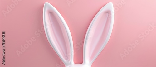 3D rendering of a white rabbit ear on a pastel pink background. Easter day.