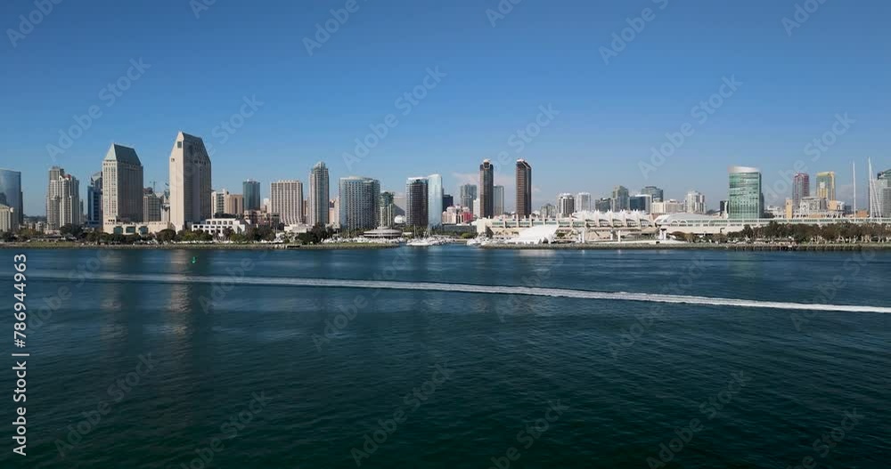 Speedboat Cruising In The Bay Along Downtown San Diego Skyline In San Diego, California. - aerial shot Speedboat Cruising In The Bay Along Downtown San Diego Skyline In San Diego, California. - aerial shot