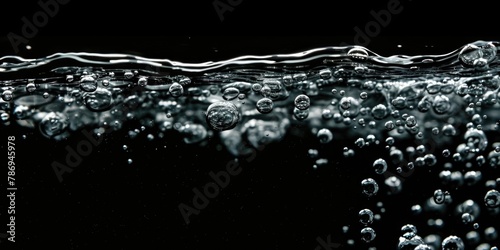 Close up of water bubbles on black background. Suitable for various design projects