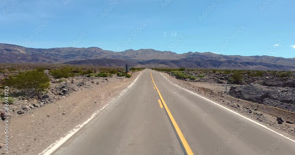 Flying Over The Two-way Road Through The Desert In California, USA. - aerial shot Flying Over The Two-way Road Through The Desert In California, USA. - aerial shot
