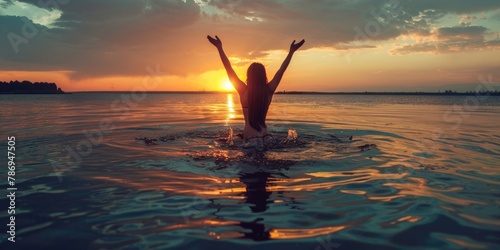 A woman standing in the water at sunset. Perfect for travel and relaxation concepts