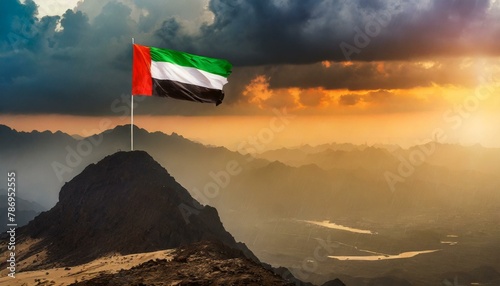 The Flag of United Arab Emirates On The Mountain. photo
