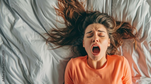 High Angle View Of A Young Woman In Bed Getting Orgasm