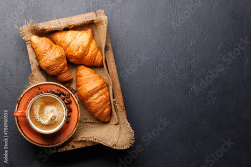 Cappuccino coffee and fresh croissants