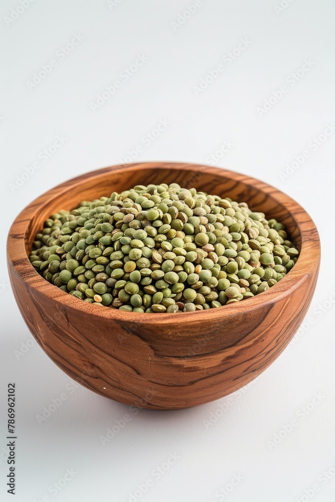 Fresh green peas in a rustic wooden bowl, suitable for healthy eating concepts Fresh green peas in a rustic wooden bowl, suitable for healthy eating concepts