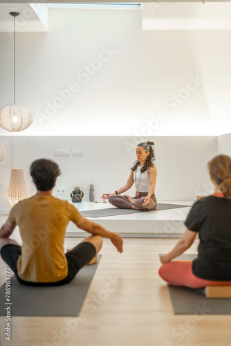 Yoga session with meditation focus in a stylish studio setting