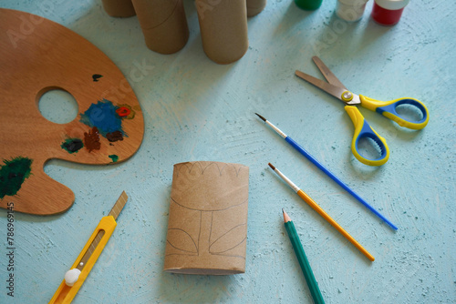 Kids craft flowers out of recycling toilet paper roll, zero waste concept. Step by step tutorial - 2.