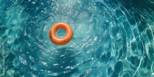 Orange Life Ring Floating in Calm Waters: Adding Safety and Fun to Outdoor Swimming Pools and Ocean Adventures