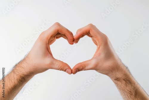 Man hands making a heart shape on a white isolated background . photo on white isolated background