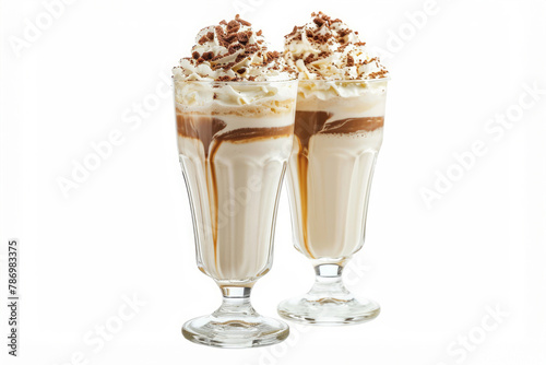 milk shakes with cream in tall glass decorated . photo on white isolated background