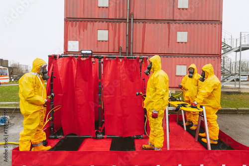 people in protective clothing and gas mask tested and work with  items during a nuclear war. danger zone. ecologi and radiation