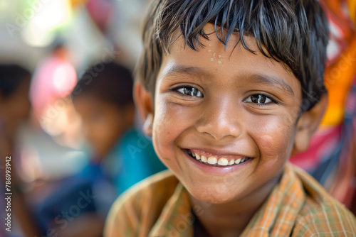 An Indian boy grins happily in an art and creativity class, enjoying the opportunity to unleash his imagination and creativity. photo