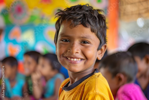 An Indian boy grins happily in an art and creativity class, enjoying the opportunity to unleash his imagination and creativity. photo