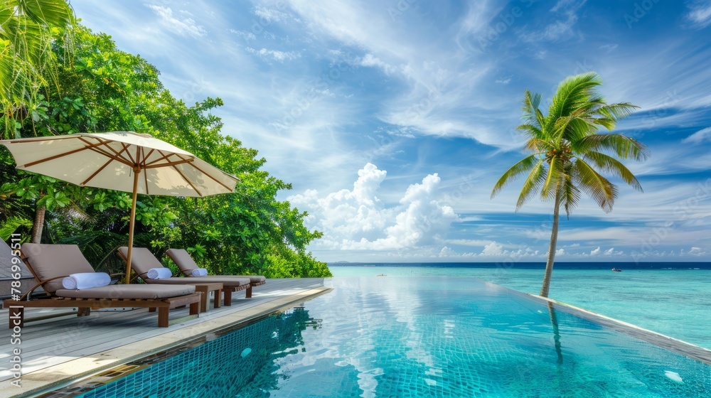 Stunning landscape, swimming pool blue sky with clouds. Tropical resort hotel in Maldives. Fantastic relax and peaceful vibes, chairs, loungers under umbrella and palm leaves. Luxury travel vacation a