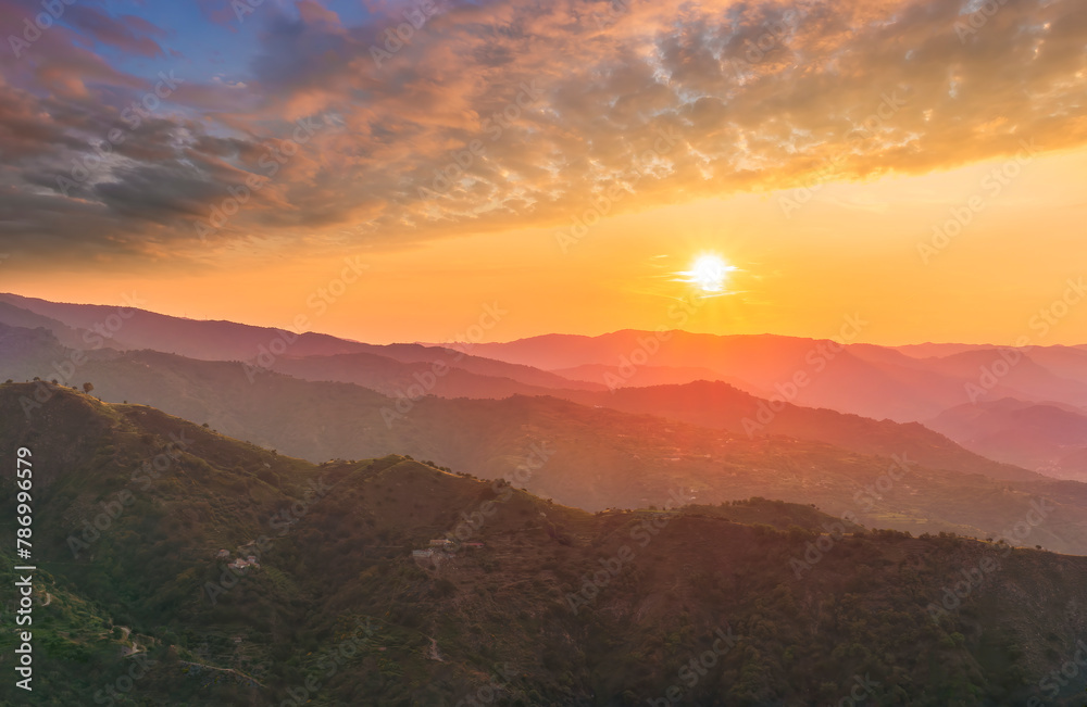 summer scenery mountain view from a highland hill to a beautiful sunset.