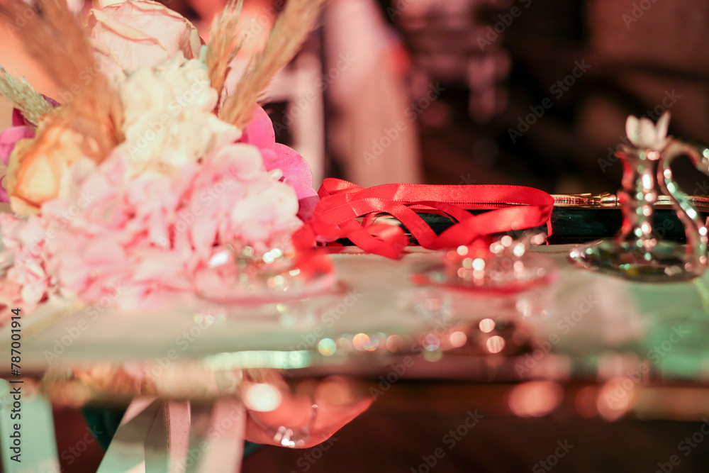 Traditional Turkish wedding ceremony tray with a bouquet, rings, and candles Traditional Turkish wedding ceremony tray with a bouquet, rings, and candles