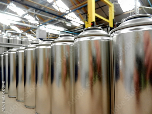 Aerosol can manufacturing in busy factory